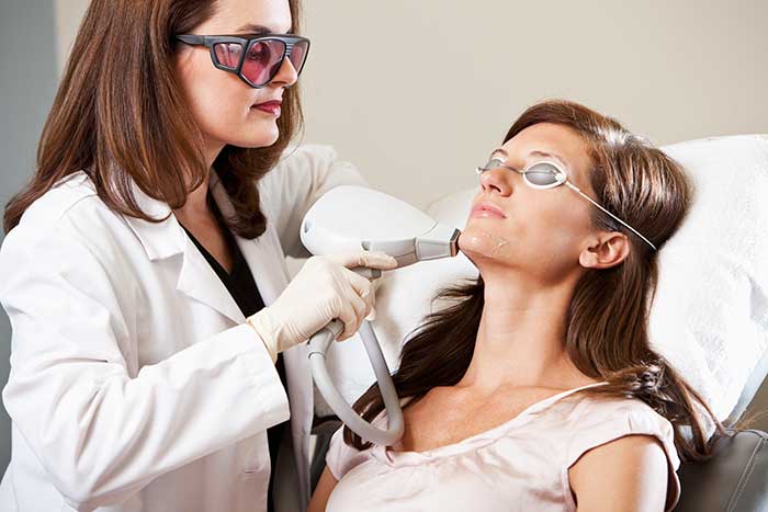 doctor performing laser therapy